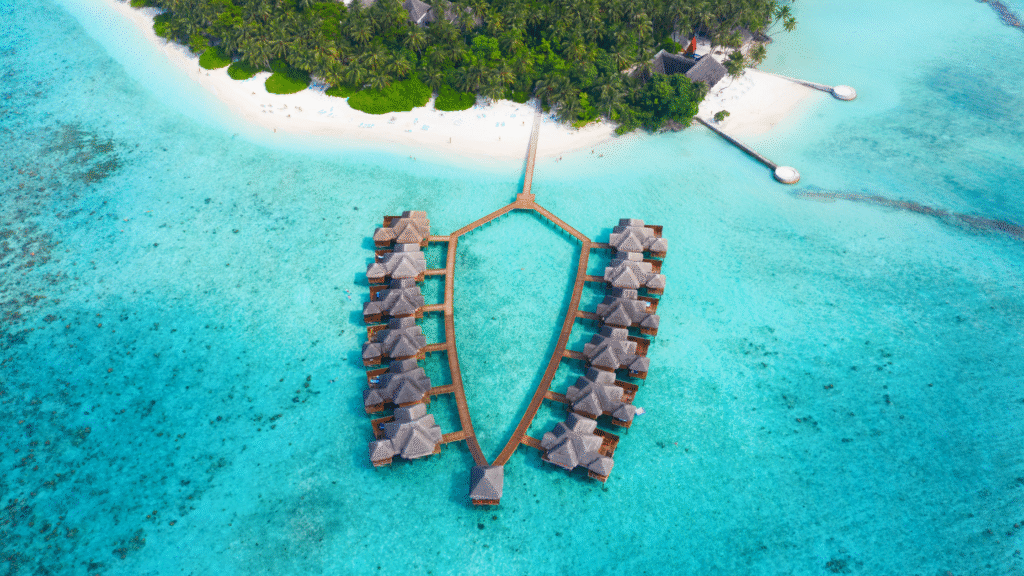 Water bungalows over turquoise ocean in the Maldives — eco-luxury travel destination for digital nomads