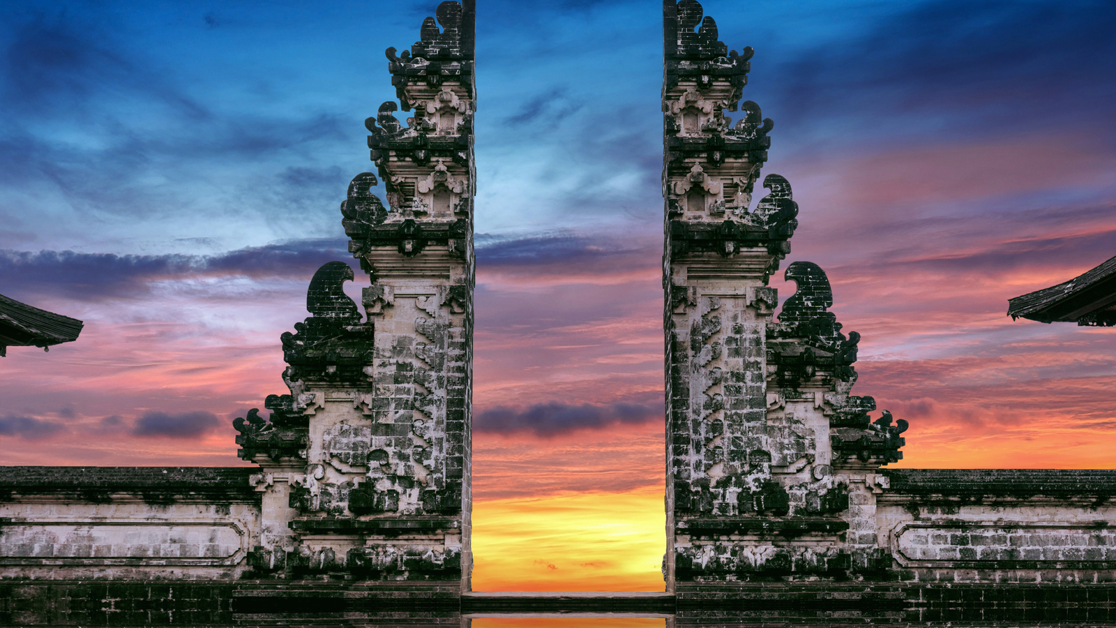Sunset at Bali temple gates — a sustainable, slow-travel destination