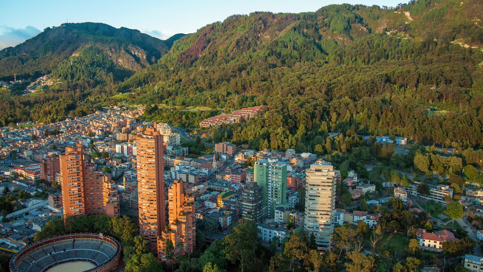 Andes mountains with community eco-lodges and trekking paths representing Latin America community ecotourism 2025