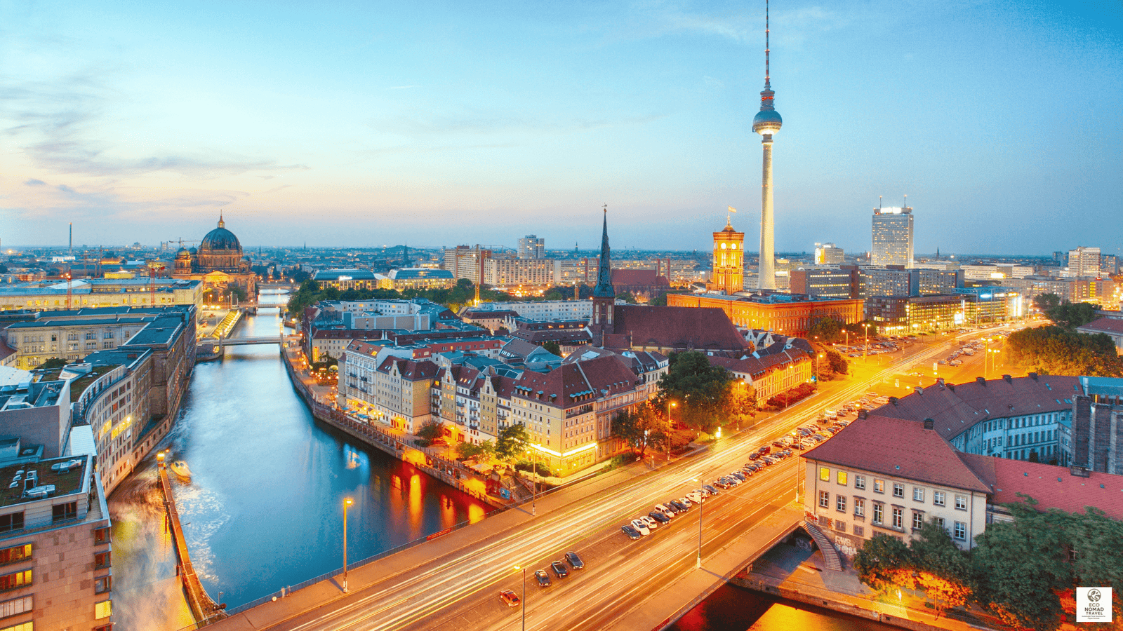 Berlin cityscape with the TV Tower and riverside buildings at sunset, highlighting a key stop on a Central Europe rail-first flight free travel itinerary in 2025
