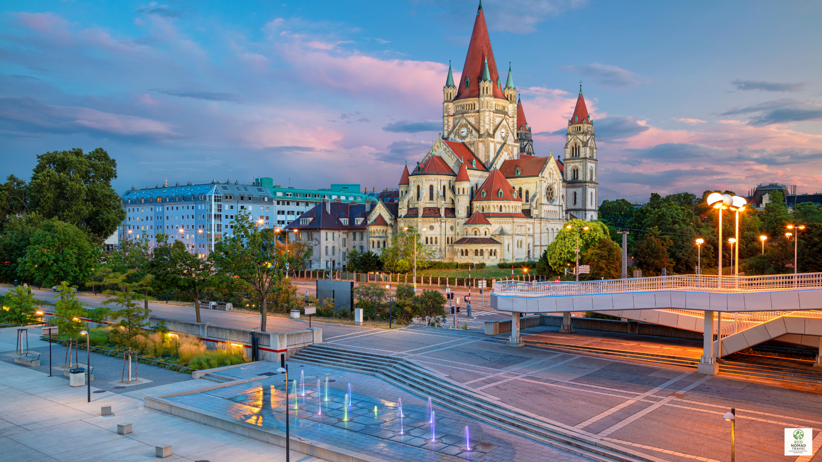 Sunset view over Vienna, Austria with historic rooftops and church towers, illustrating a classic stop on a Central Europe rail-first flight free travel itinerary in 2025