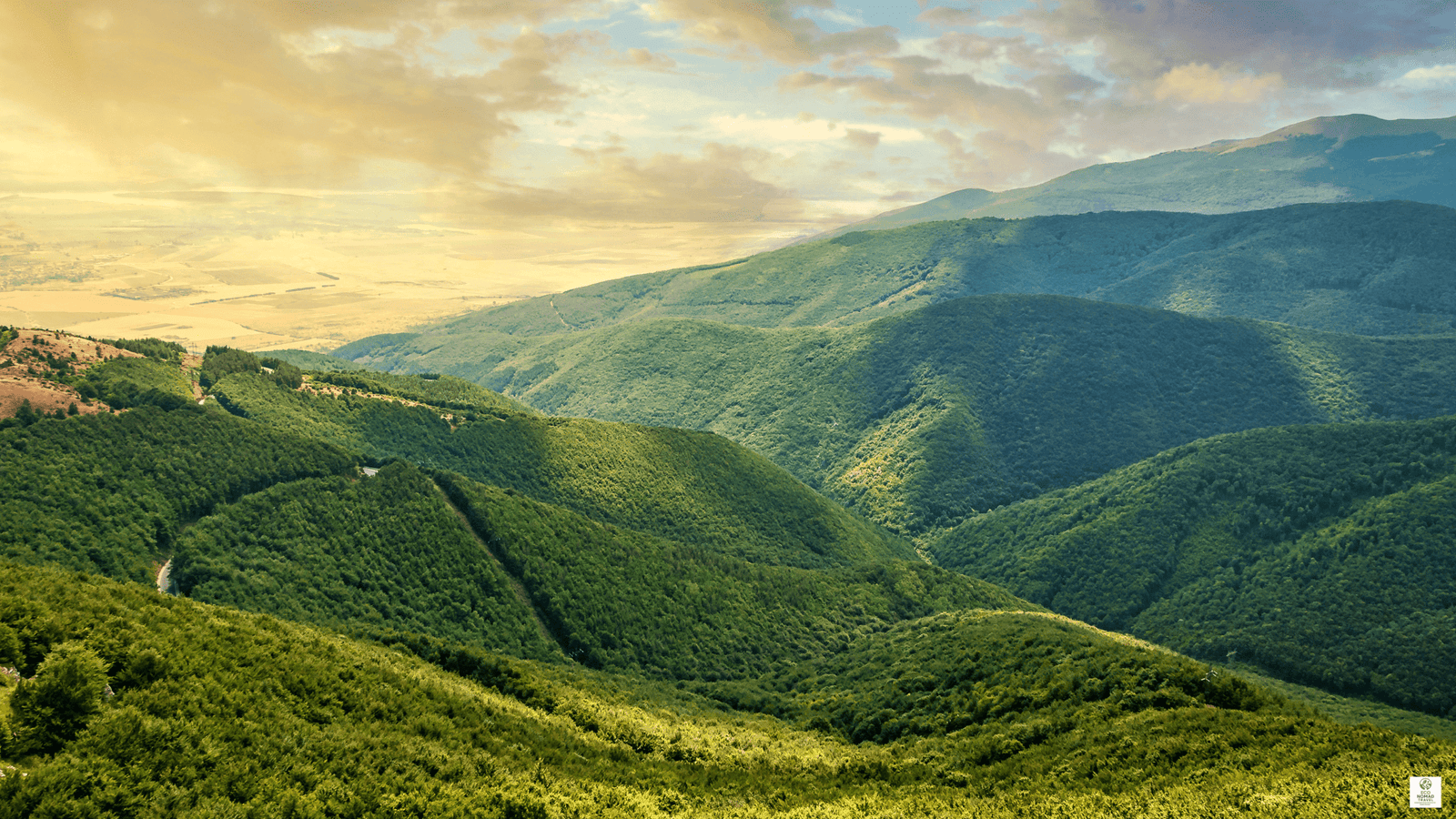 Balkan Mountains panorama with rugged peaks and forested valleys on a slow-travel route