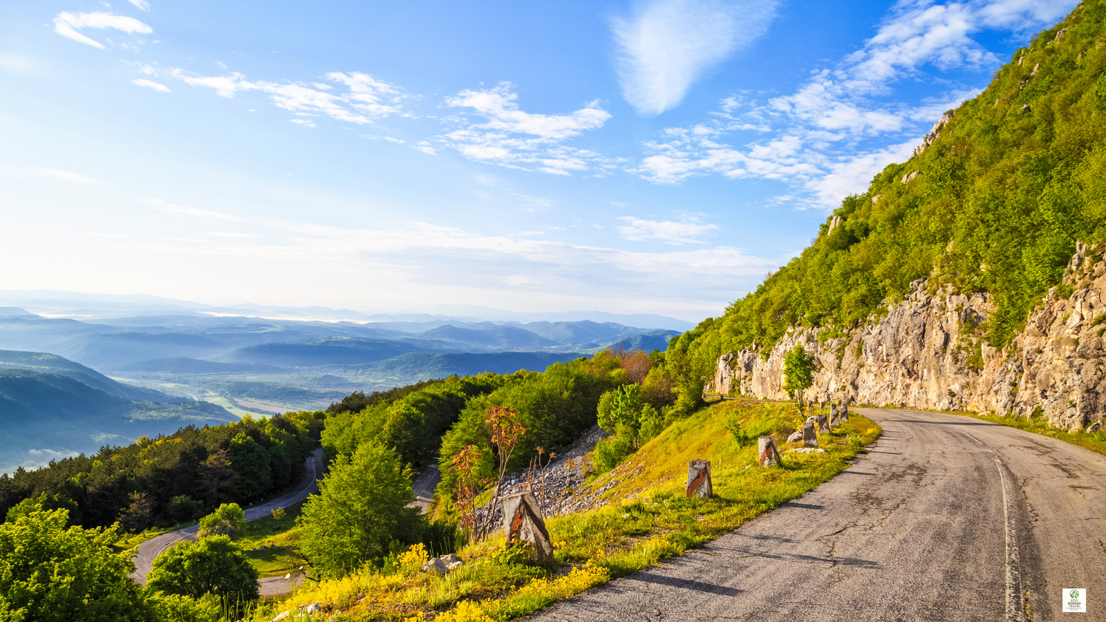 Winding mountain road through the Balkan Mountains with sweeping switchbacks and dramatic views