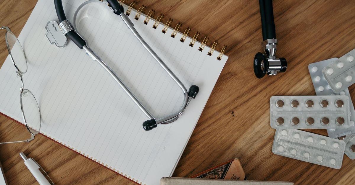 A stethoscope resting on a clipboard