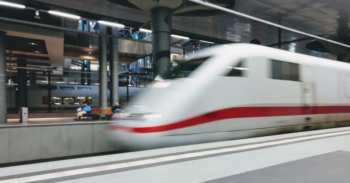 A modern high-speed train waiting at a platform