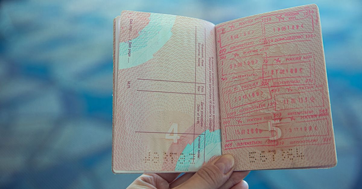 An open passport showing entry stamps