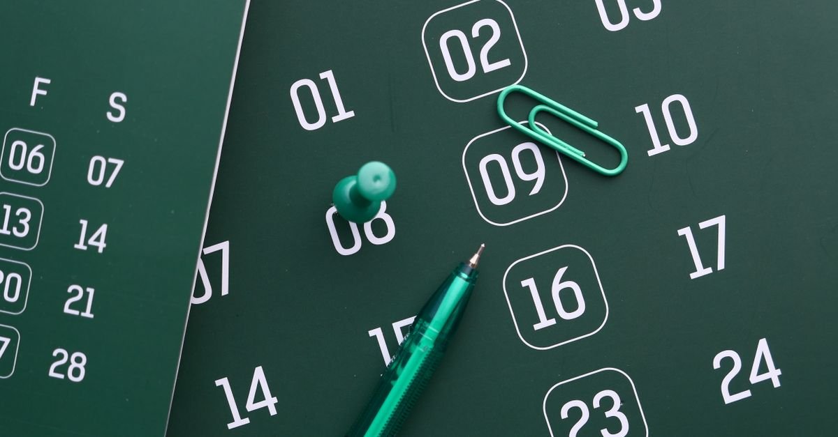 A calendar and pen laid out for planning dates